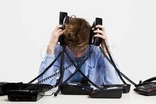 21717790-young-man-in-the-office-and-answering-several-phones-at-the-same-time.jpg